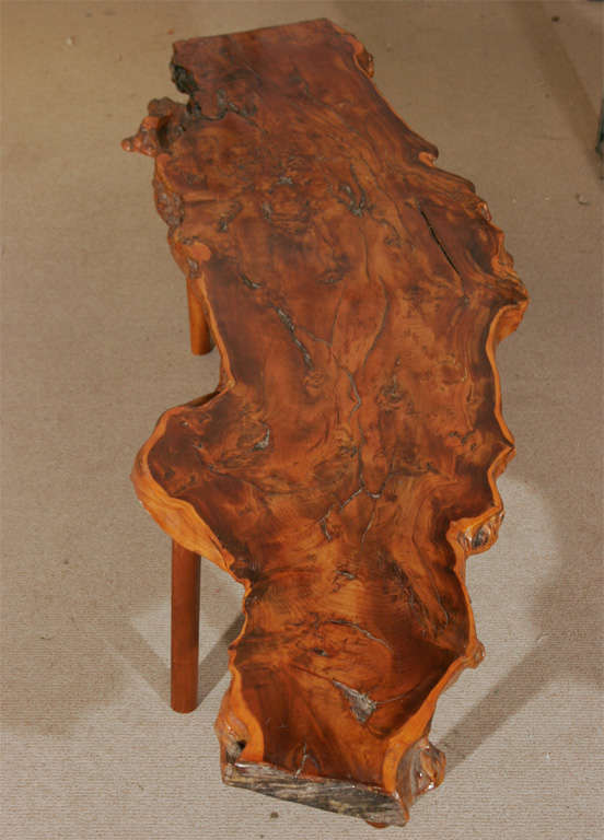A rustic Yew wood Coffee Table by Reynolds of Ludlow. Supported on shaped tapering legs.<br />
Stamped to base.<br />
Reynolds of Ludlow started business at the start of the 1950's- a father and Son artisan venture- and it traded until the late